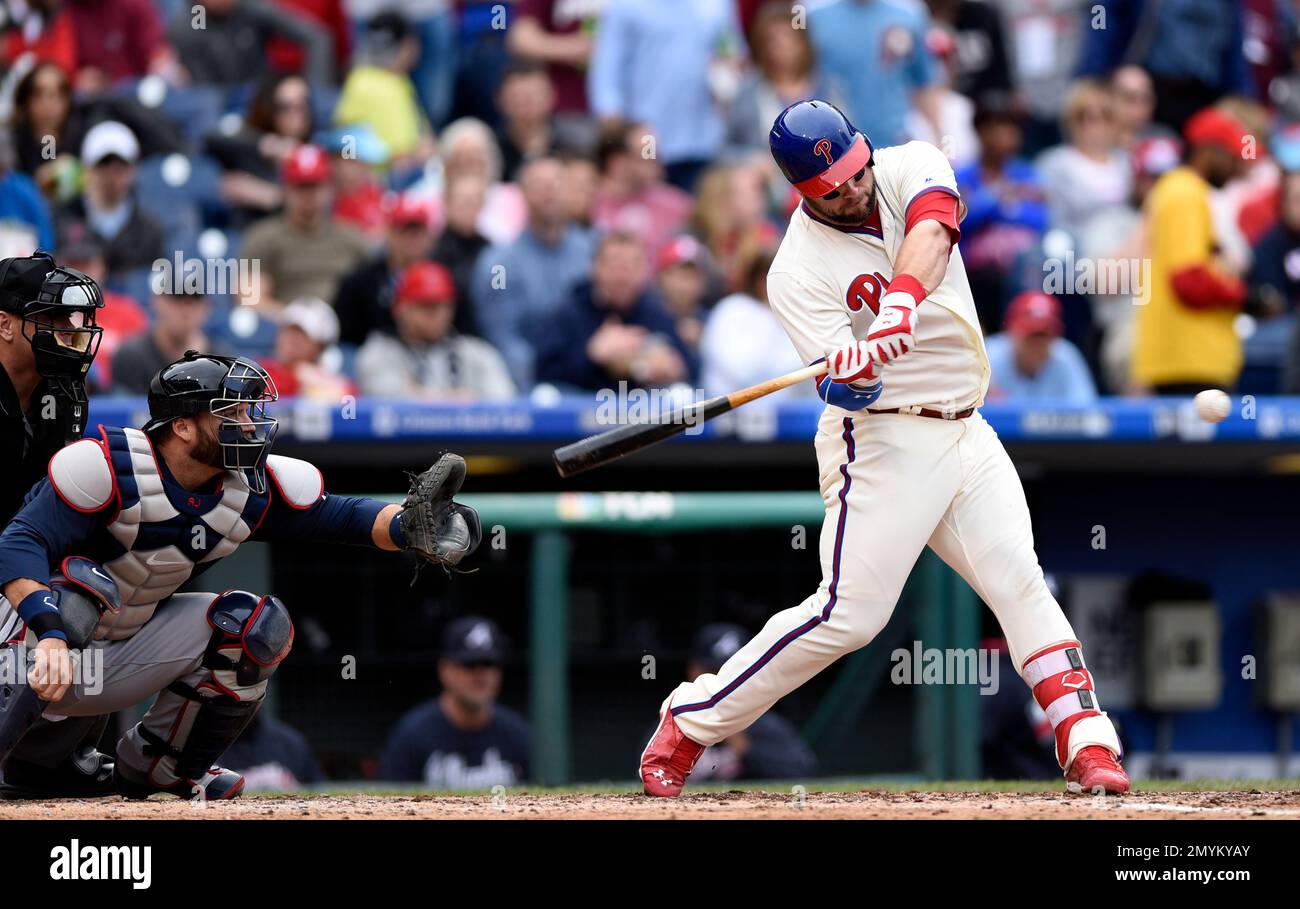 Philadelphia Phillies' Cameron Rupp hits a single in front of Atlanta ...