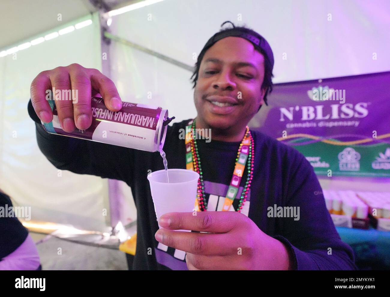 St. Louis, United States. 04th Feb, 2023. Salesman Jamie Coleman pours a can of Wynk Cannabis Infused seltzer into a cup for a curious customer at the St. Louis Mardi Gras 4th Estate Cooking Competition in St. Louis on Saturday, February 4, 2023. Coleman and several employees manned the booth to pass out samples of the non- alcoholic drink, laced with THC, one day after Missouri legalized the sale of recreational cannabis. Photo by Bill Greenblatt/UPI Credit: UPI/Alamy Live News Stock Photo