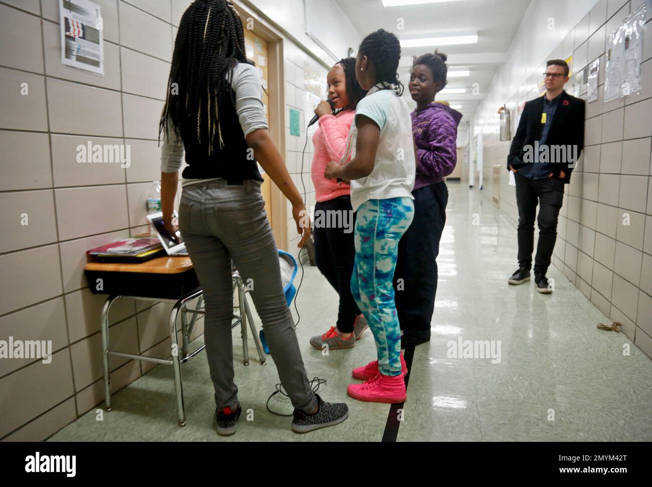 Alex Rappaport, far right, co-founder and CEO of tech company Flocabulary,  observe as fifth graders Davonayshia Hollis, far left, Anesha Stewart,  second from left, Denaya Rippey, center Emily Rink, second from right,
