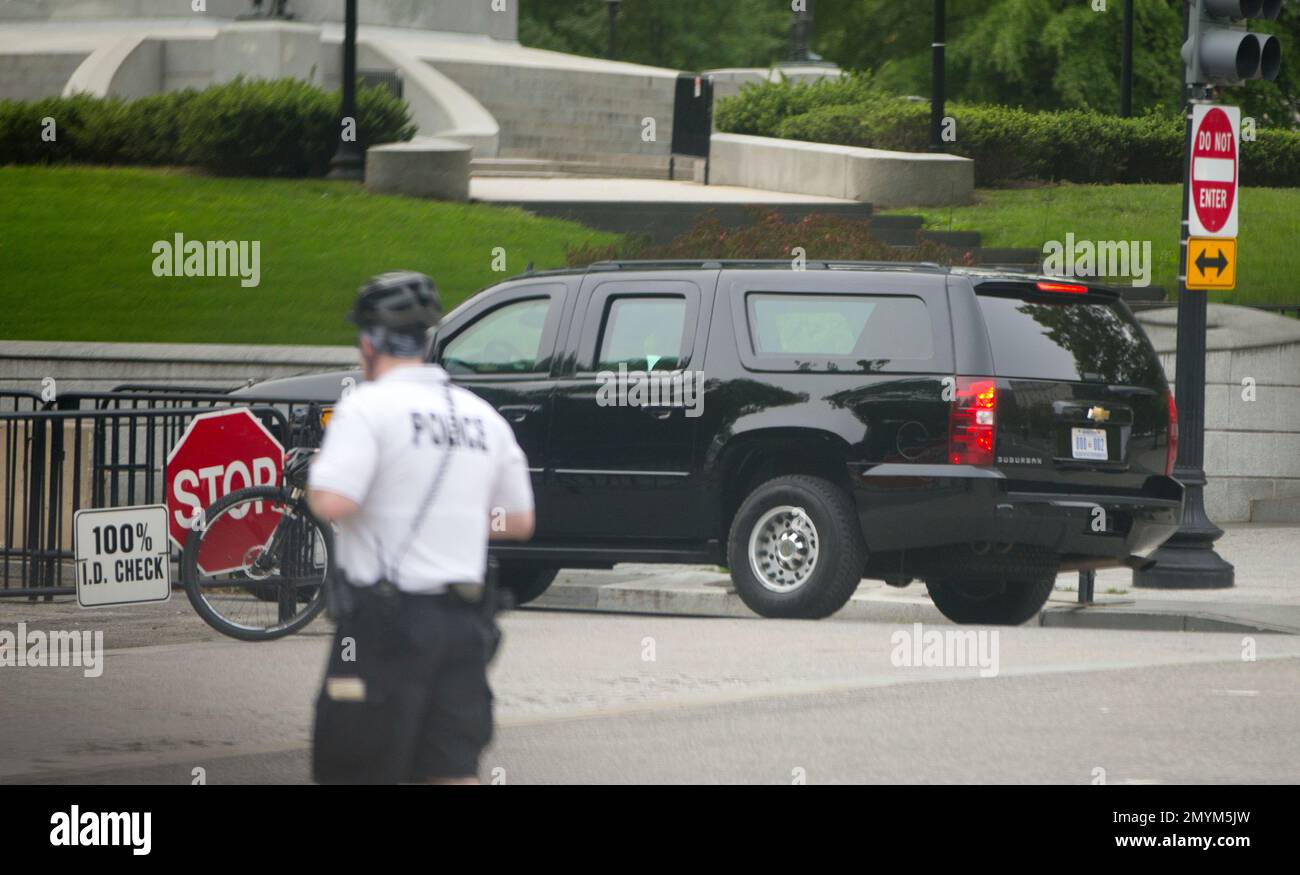 President Barack Obama's armored SUV makes the turn at a security ...