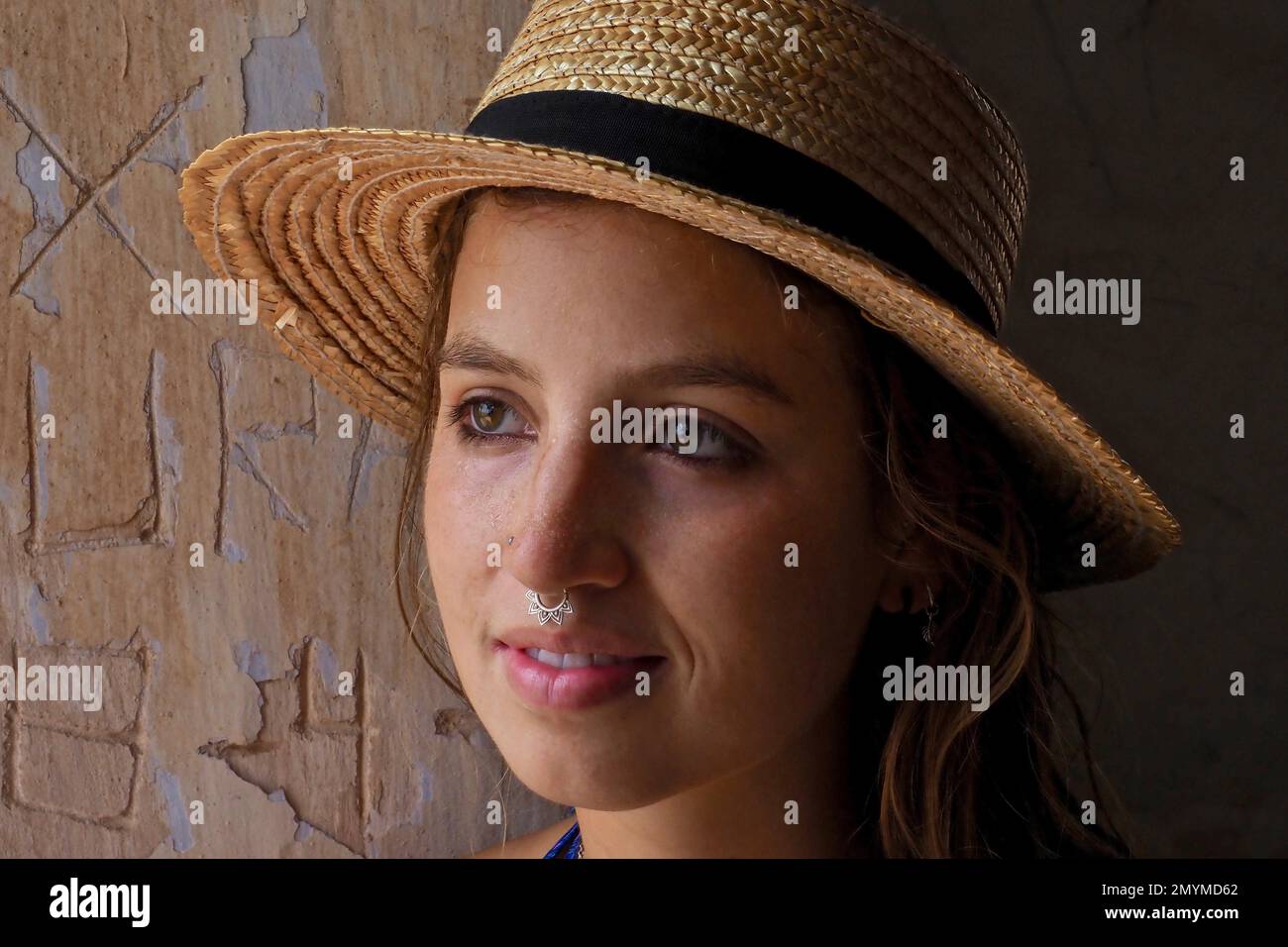 Young woman with straw hat and nose piercing Stock Photo