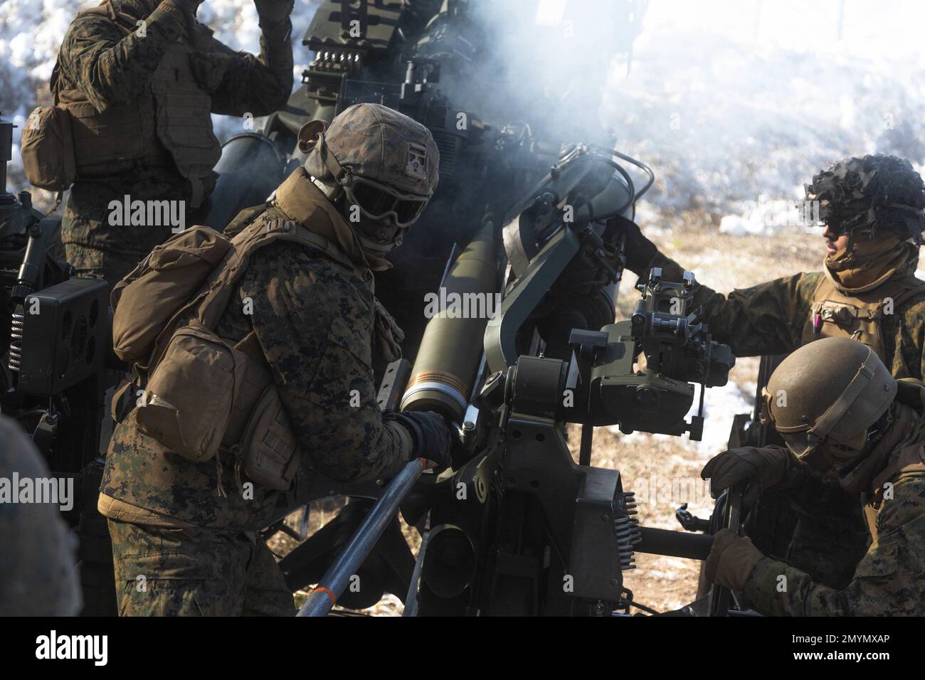 U.S. Marine Corps Lance Cpl. Terrence Hinton, a field artillery cannoneer with 3d Battalion, 12th Marines, reloads an M777 towed 155 mm howitzer while conducting live-fire training during Artillery Relocation Training Program 22.4 at the Yausubetsu Maneuver Area, Hokkaido, Japan, Jan. 30, 2023. The skills developed at ARTP increase the proficiency and readiness of the only permanently forward-deployed artillery unit in the Marine Corps, enabling them to provide precision indirect fires. Hinton is a native of Los Angeles, California. (U.S. Marine Corps photo by Lance Cpl. Jaylen Davis.) Stock Photo