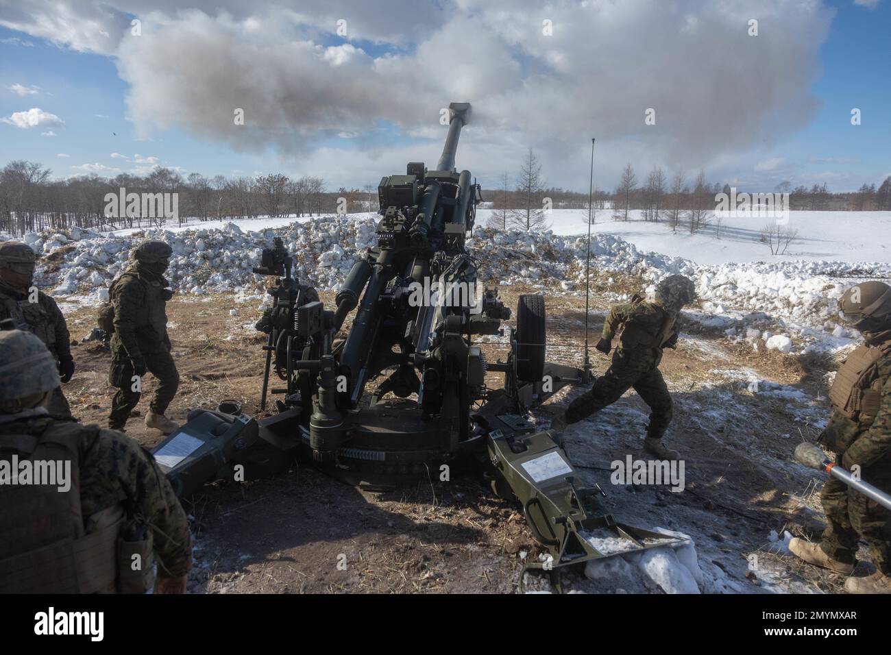 U.S. Marines with 3d Battalion, 12th Marines fire an M777 towed 155 mm howitzer while conducting live-fire training during Artillery Relocation Training Program 22.4 at the Yausubetsu Maneuver Area, Hokkaido, Japan, Jan. 31, 2023. The skills developed at ARTP increase the proficiency and readiness of the only permanently forward-deployed artillery unit in the Marine Corps, enabling them to provide precision indirect fires. (U.S. Marine Corps photo by Lance Cpl. Jaylen Davis.) Stock Photo