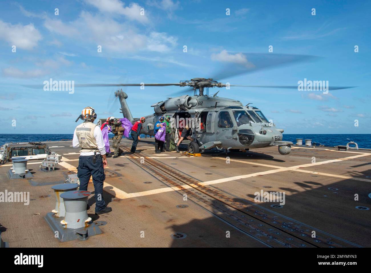 230204-N-MK109-1030 SOUTH CHINA SEA (Feb. 4, 2023) U.S. Navy Sailors receive mail aboard the Arleigh Burke-class guided-missile destroyer USS Wayne E. Meyer (DDG 108). Wayne E. Meyer, part of the Nimitz Carrier Strike Group, is in U.S. 7th Fleet conducting routine operations. 7th Fleet is the U.S. Navy’s largest forward-deployed numbered fleet, and routinely interacts and operates with Allies and partners in preserving a free and open Indo-Pacific region. (U.S. Navy photo by Mass Communication Specialist 3rd Class Mykala Keckeisen) Stock Photo