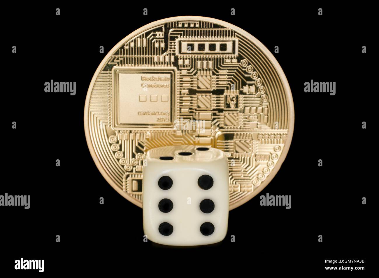 A dice in front of a coin, cryptocurrency, studio photography with ...
