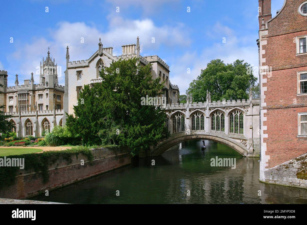 View of Cambridge University from a bridge over the River Cam, with the covered Bridge of Sighs connecting two colleges Stock Photo