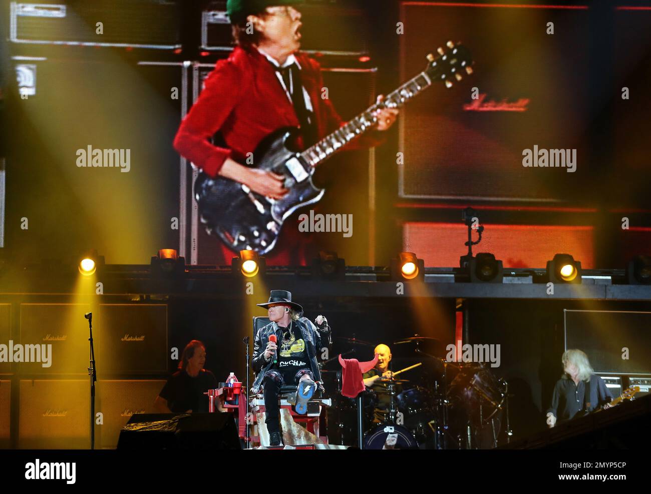 AC/DC lead guitar player Angus Young is shown on the screen while ...