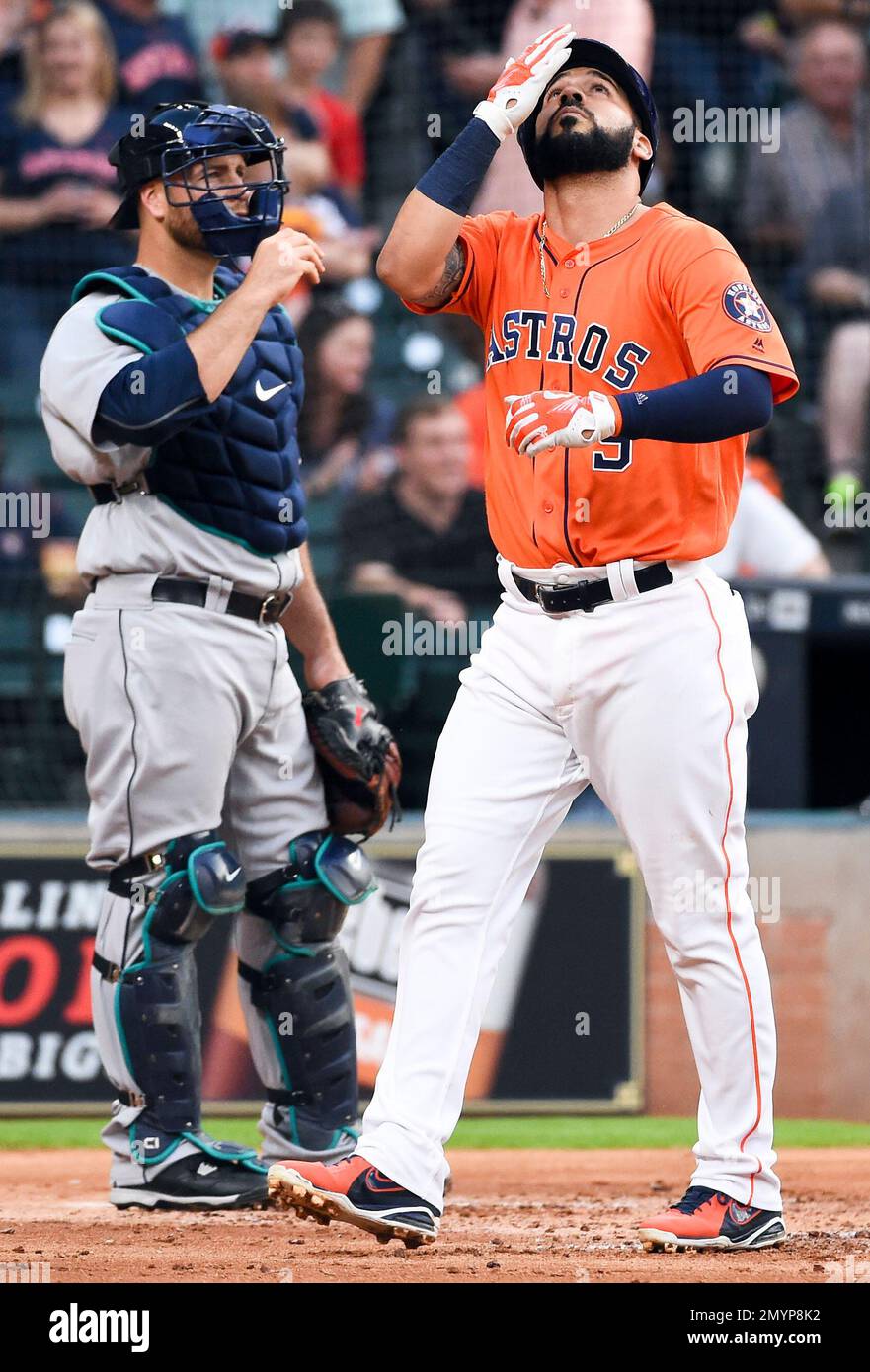 Houston Astros' Marwin Gonzalez, right, is tagged out by Los