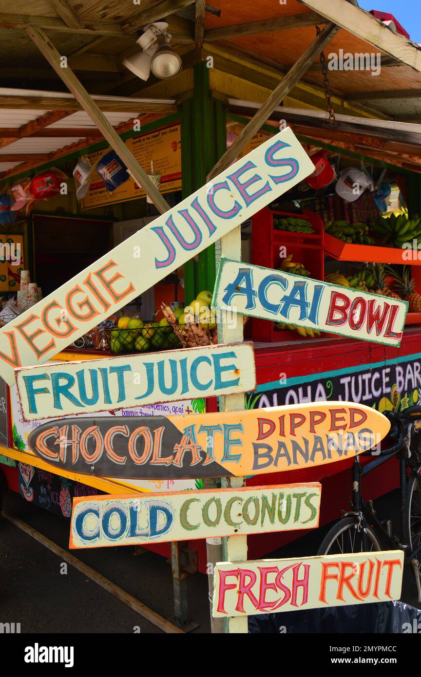 An organic tropical fruit stand displays their offerings Stock Photo