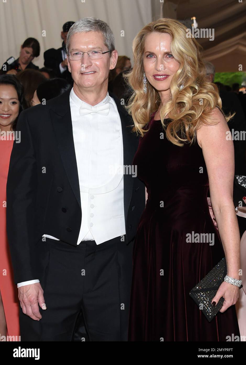 Apple CEO Tim Cook, left, and Laurene Powell arrive at The Metropolitan ...