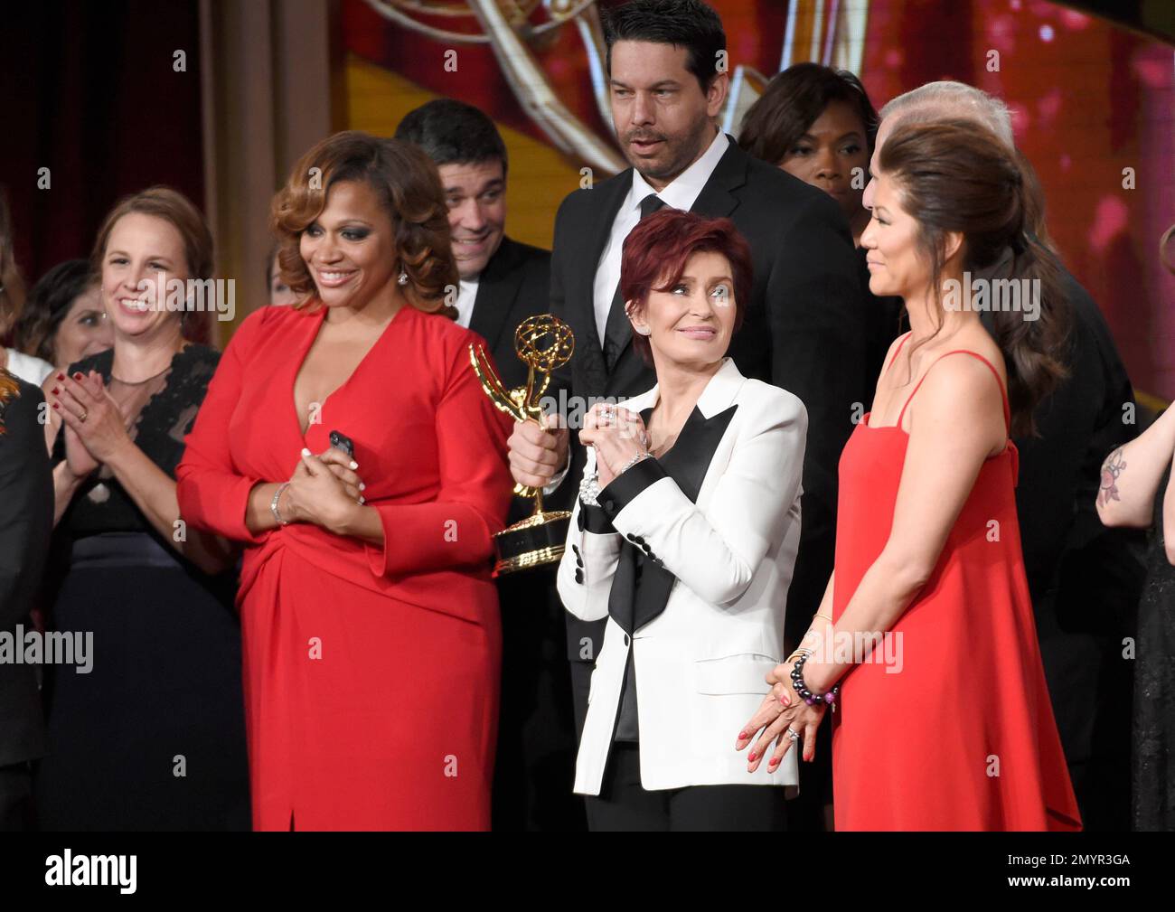 Sharon osbourne second from left and julie chen with cast and crew