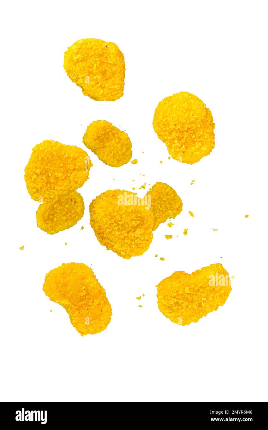 Freeze motion of flying chicken pieces on a white background. Concept