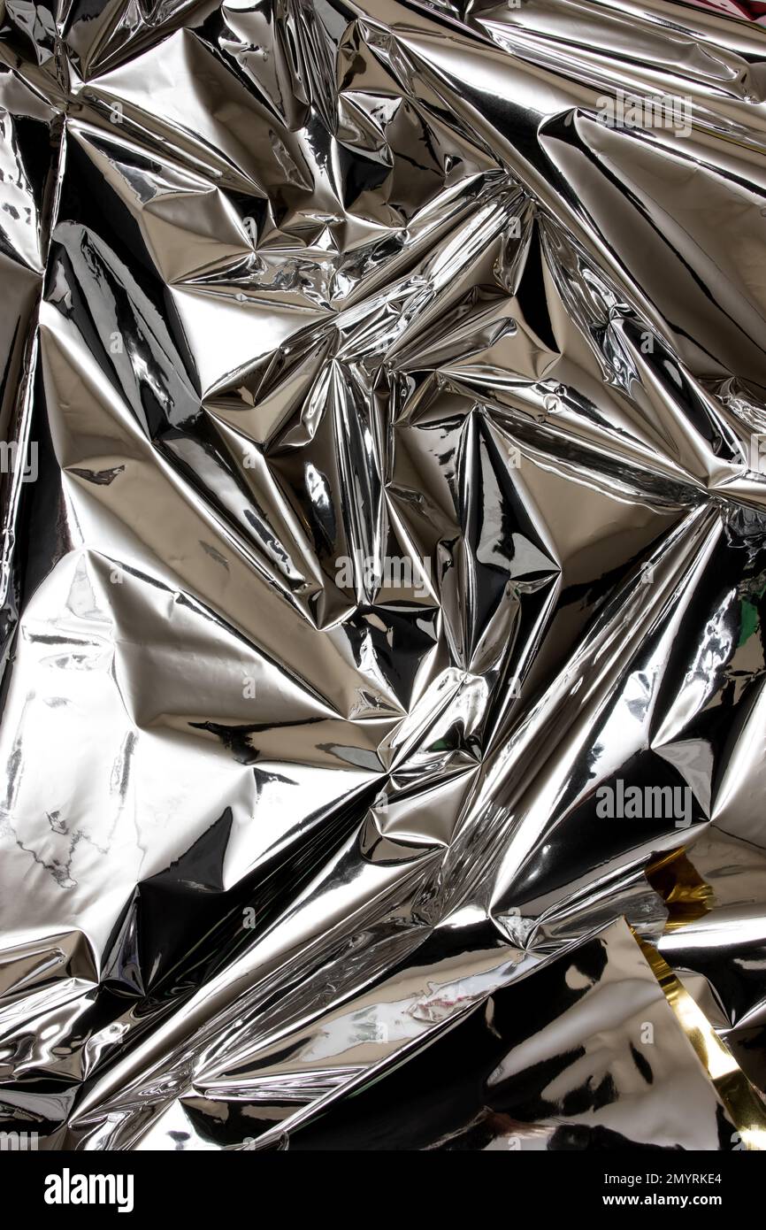 Shiny silver foil close-up. Abstract background, glossy surface Stock Photo  - Alamy