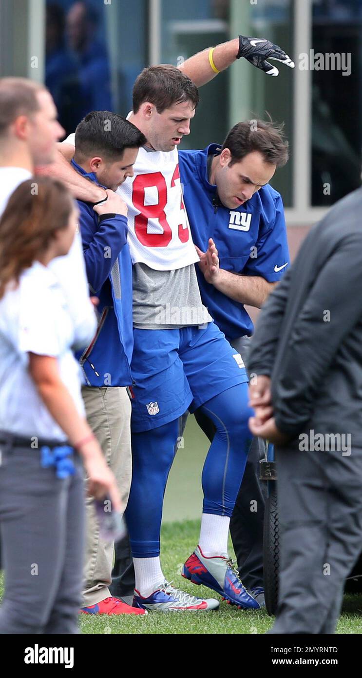 New York Giants wide receiver Ben Edwards (83) is helped off the field