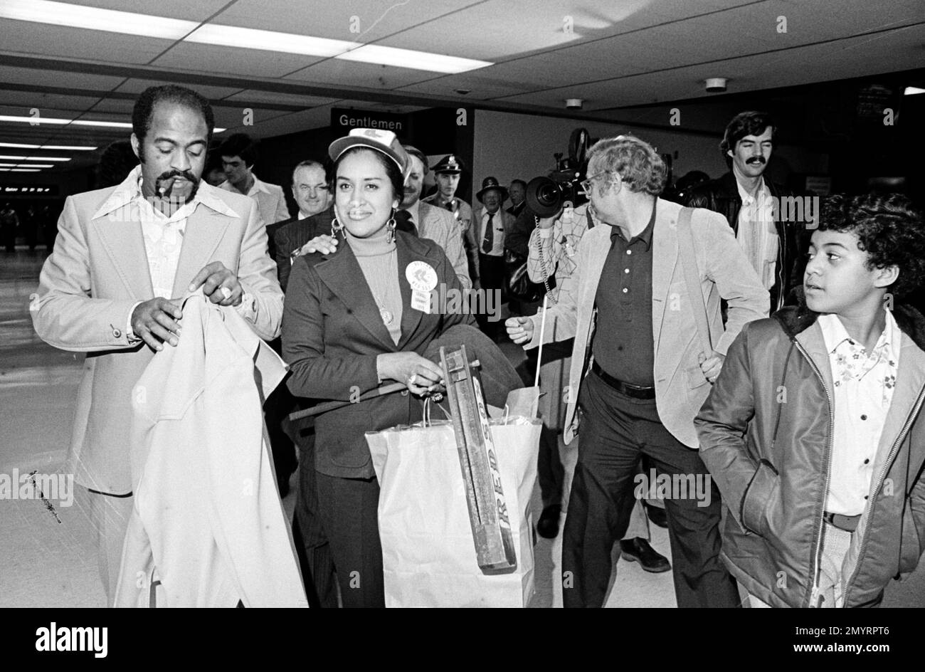 Luis Tiant, Boston Red Sox pitcher, escorts his wife, Maria, from