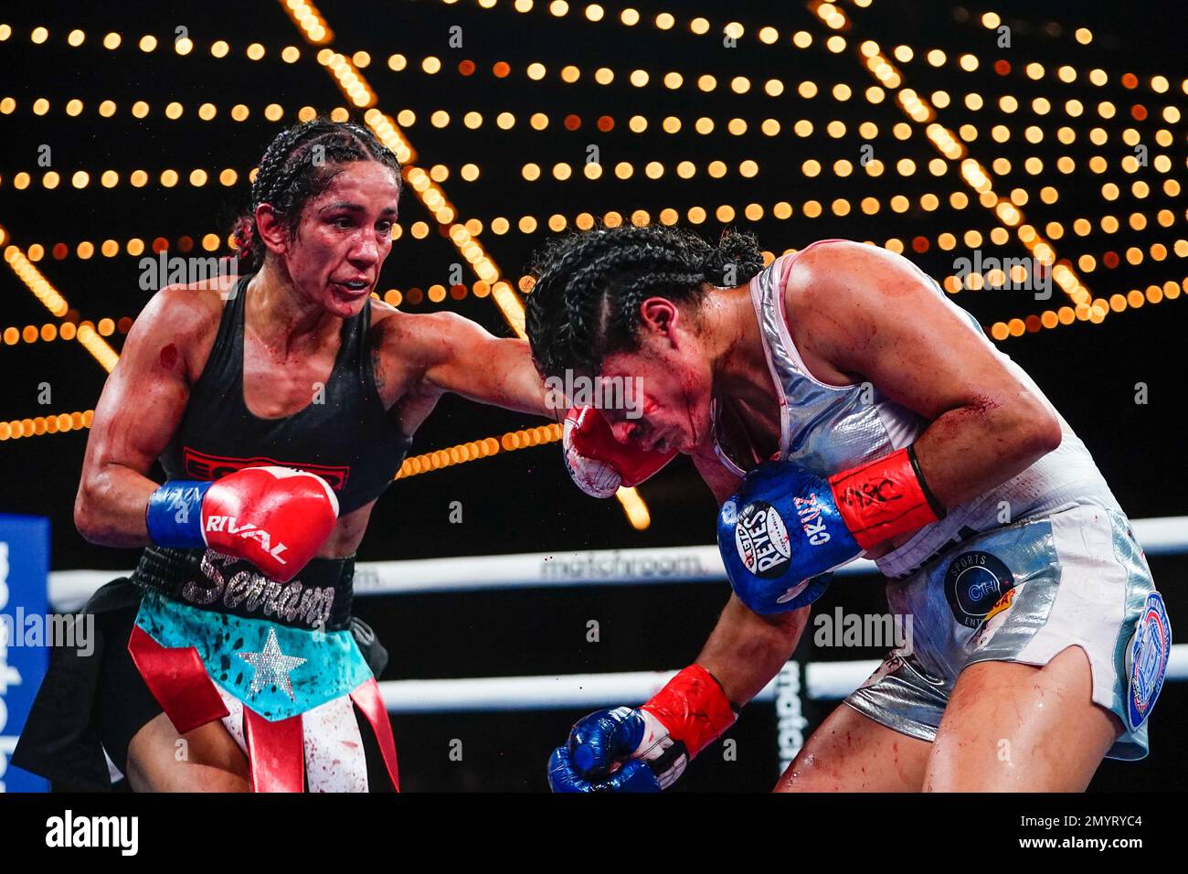 Puerto Rico's Amanda Serrano, left, punches Mexico's Erika Cruz