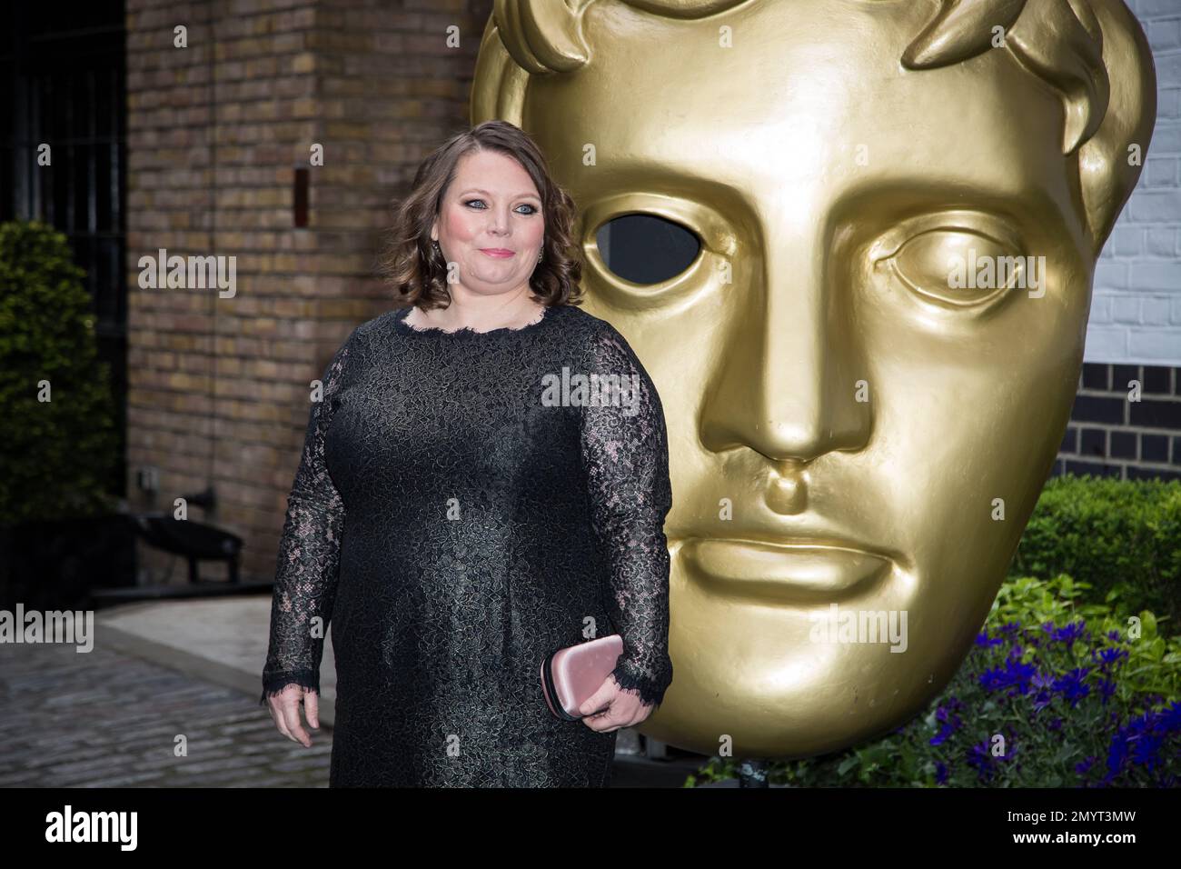 Joanna Scanlan poses for photographers upon arrival at the British