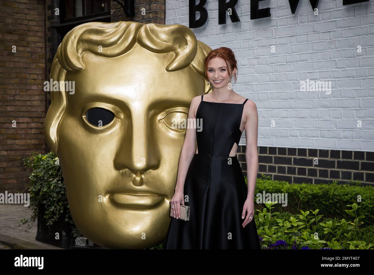 Actress Eleanor Tomlinson poses for photographers upon arrival at the ...