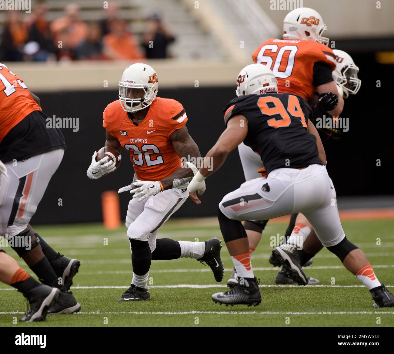 Oklahoma State orange team running back Chris Carson (32) tries to run ...