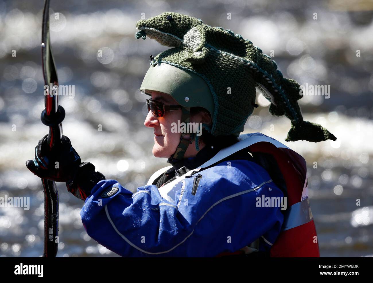 A kayaker wears a costume helmet cover while competing in the 50th Kenduskeag Stream Canoe Race, Saturday, April 16, 2016, in Bangor, Maine