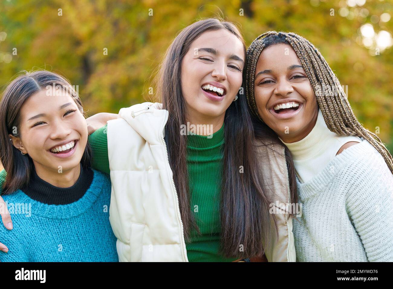 Multiethnic friends having fun in the park Stock Photo