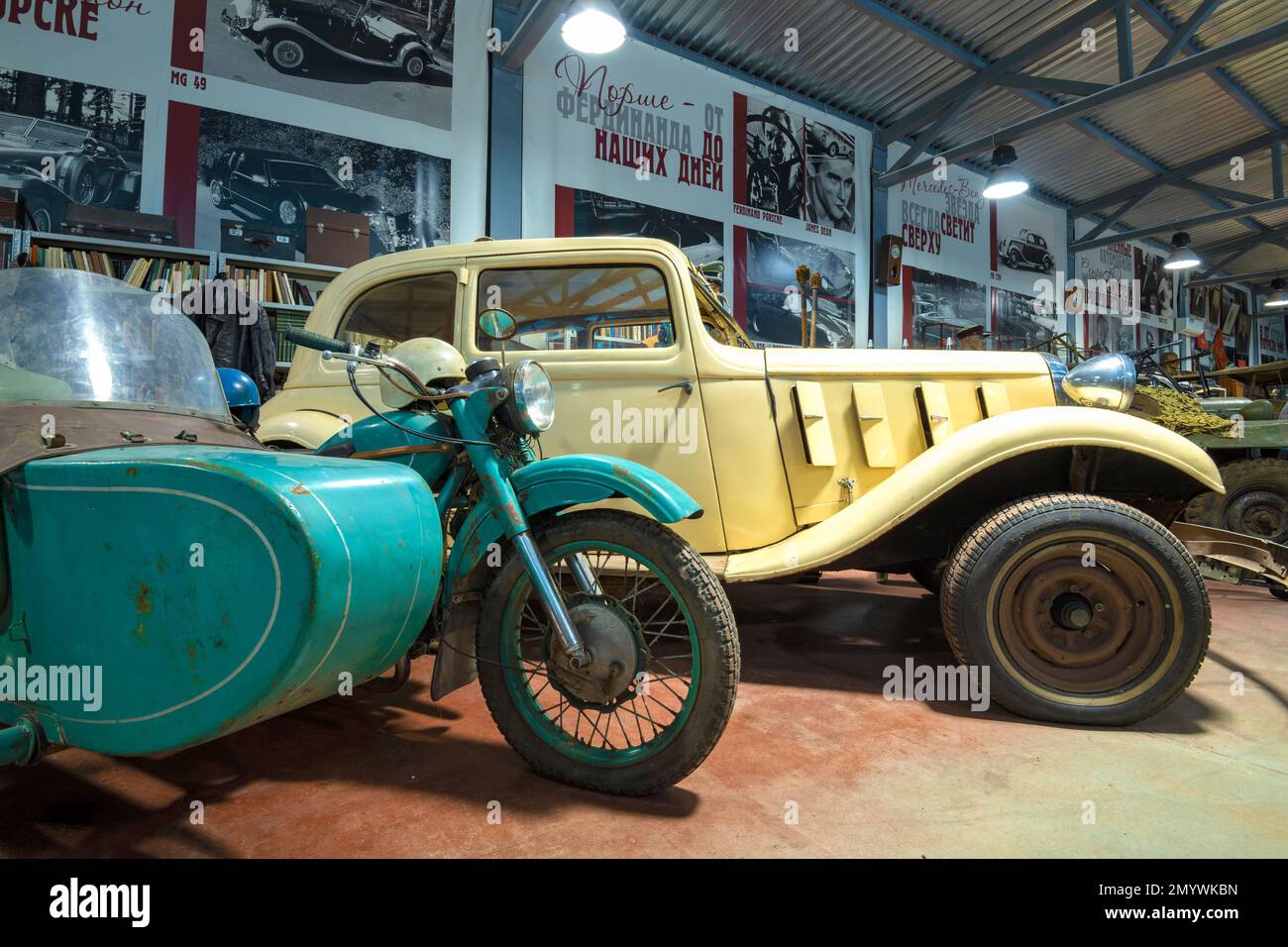 ZELENOGORSK, RUSSIA - JANUARY 27, 2023: Soviet motorcycle 'Ural' and German car Hanomag Rekord Diesel Typ D (1938) in the Museum of retro cars Stock Photo