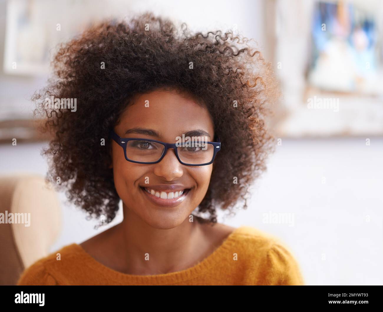Young woman smiling curly hair hi-res stock photography and images - Alamy