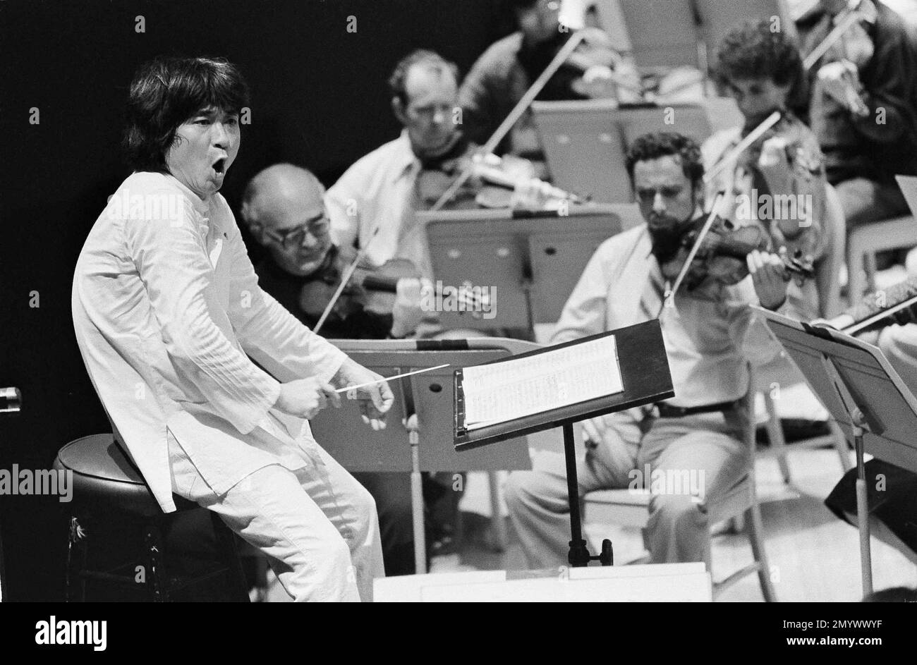 Boston Symphony Orchestra conductor Seiji Ozawa rehearses with members