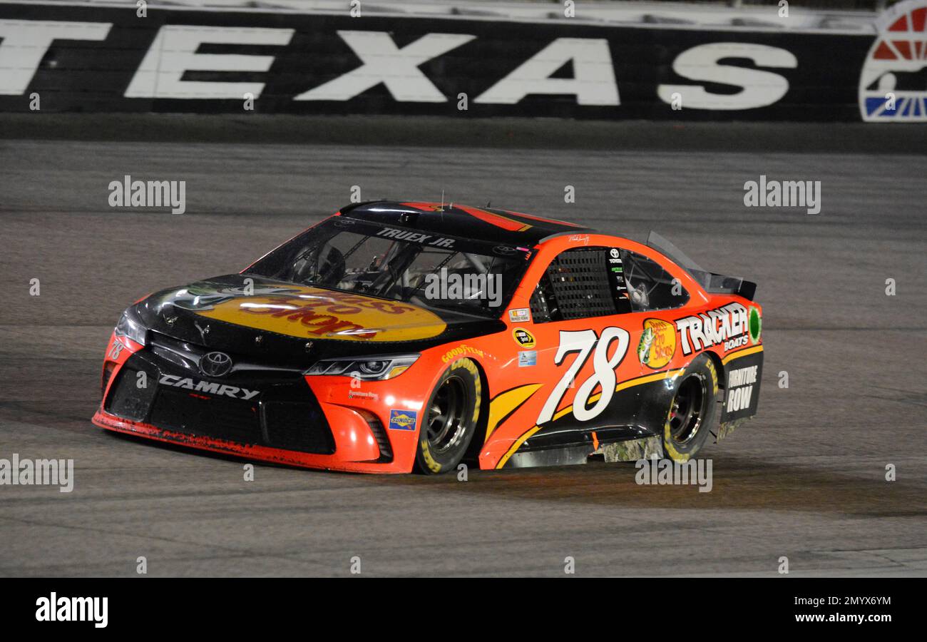 Martin Truex Jr. (78) drives during the NASCAR Sprint Cup Series auto race at Texas Motor Speedway in Fort Worth, Texas, Saturday, April 9, 2016. (AP Photo/Larry Papke) Stock Photo