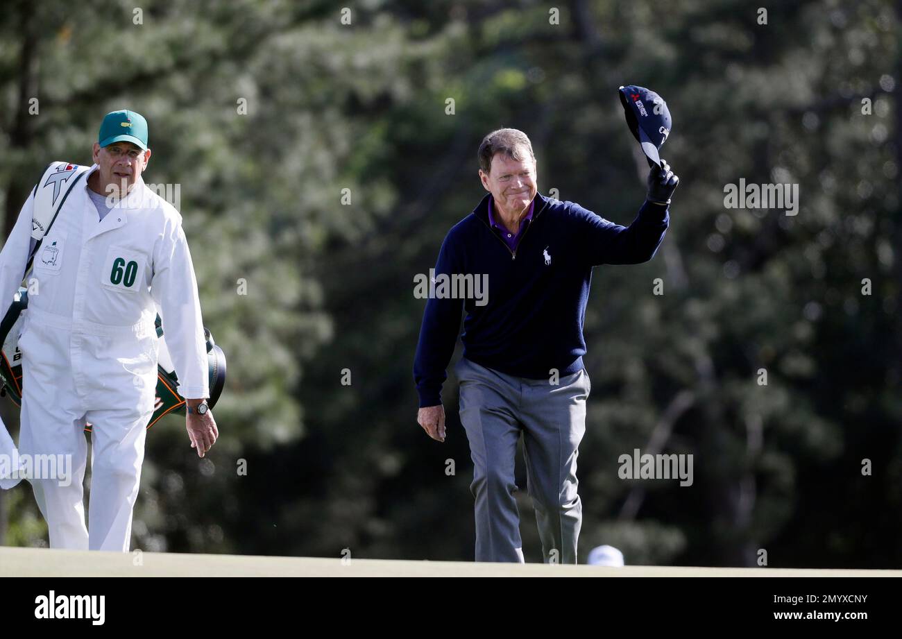Tom Watson tips his cap on the 18th hole after playing his last round