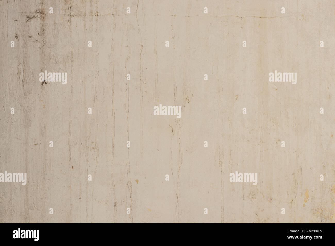 dirty white wall of a house as a background close up Stock Photo