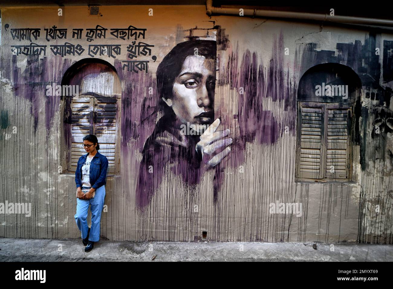 Kolkata, India. 04th Feb, 2023. A young lady poses for photos in front of a beautiful wall graffiti during an open air Art Fest. Kolkata streets and different slums seen getting painted with colorful graffitis as an initiative of an ongoing Art Fest (Behala Art Fest). Artists from different art colleges have participated to make the city more beautiful. Credit: SOPA Images Limited/Alamy Live News Stock Photo