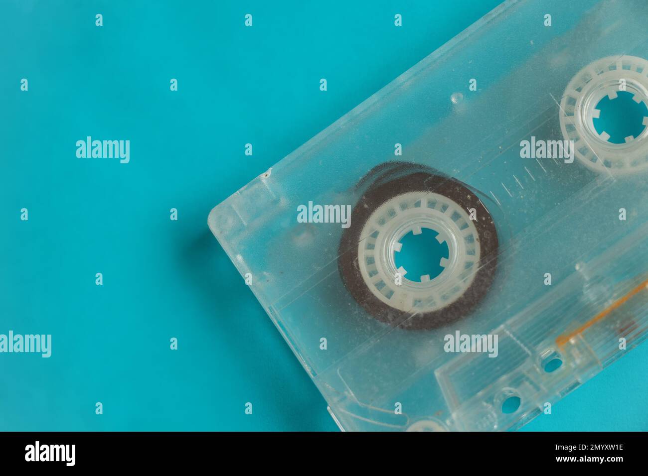 Old music cassette lies on a blue background Stock Photo