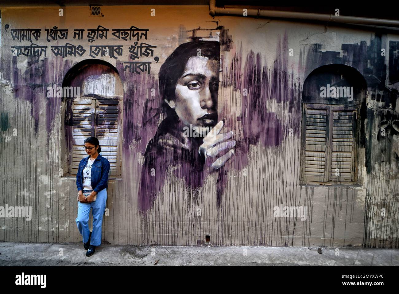 Kolkata, India. 04th Feb, 2023. A young lady poses for photos in front of a beautiful wall graffiti during an open air Art Fest. Kolkata streets and different slums seen getting painted with colorful graffitis as an initiative of an ongoing Art Fest (Behala Art Fest). Artists from different art colleges have participated to make the city more beautiful. (Photo by Avishek Das/SOPA Images/Sipa USA) Credit: Sipa USA/Alamy Live News Stock Photo