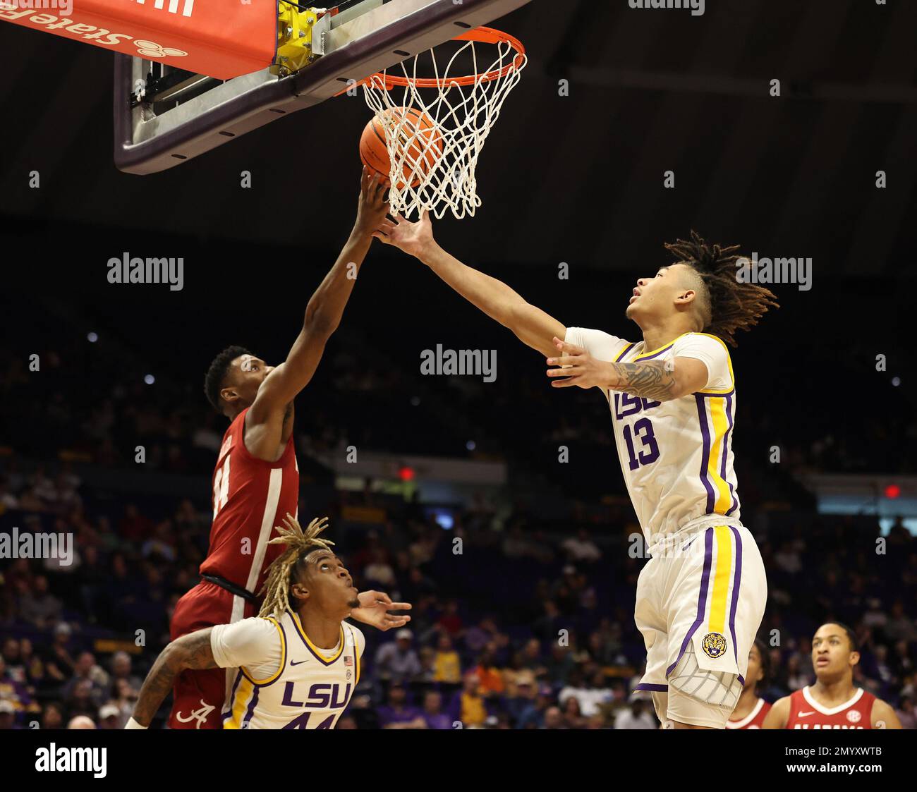 Baton Rouge, USA. 04th Feb, 2023. Alabama Crimson Tide forward Brandon Miller (24) and LSU Tigers forward Jalen Reed (13) both reach for the ball during a men's college basketball game at the Pete Maravich Assembly Center in Baton Rouge, Louisiana on Saturday, February 4, 2023. (Photo by Peter G. Forest/Sipa USA) Credit: Sipa USA/Alamy Live News Stock Photo