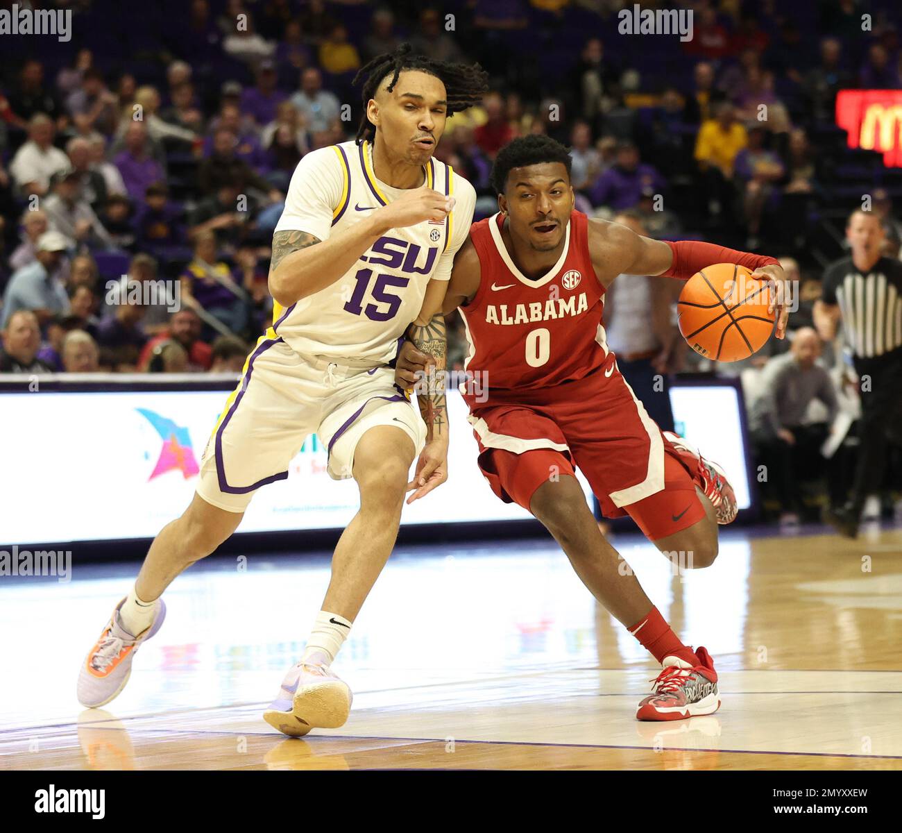 Baton Rouge, USA. 04th Feb, 2023. Alabama Crimson Tide guard Jayden Bradley (0) tries to get past LSU Tigers forward Tyrell Ward (15) during a men's college basketball game at the Pete Maravich Assembly Center in Baton Rouge, Louisiana on Saturday, February 4, 2023. (Photo by Peter G. Forest/Sipa USA) Credit: Sipa USA/Alamy Live News Stock Photo
