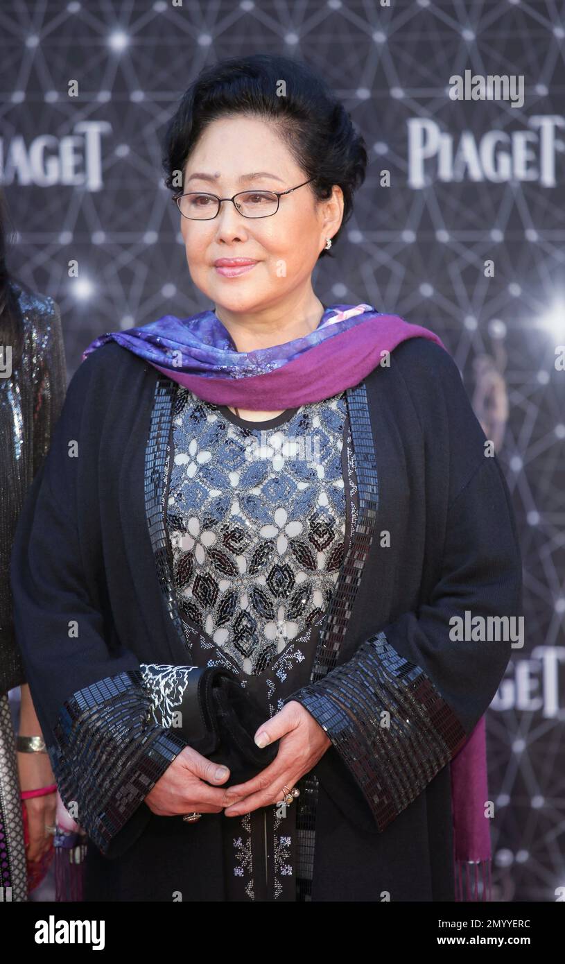 Chinese actress Siqin Gaowa poses on the red carpet of the Hong Kong