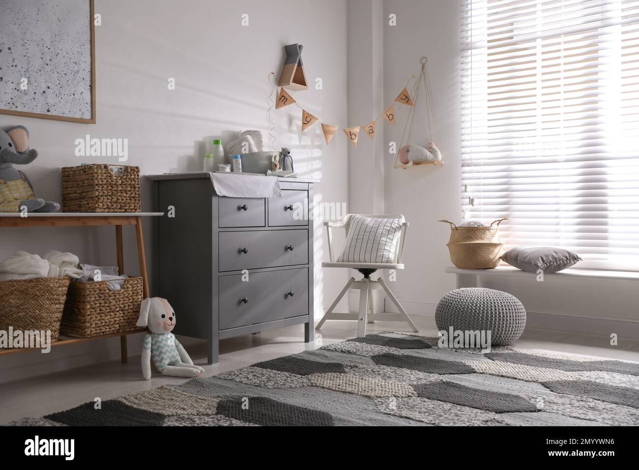 Chest of drawers with changing place in baby room. Interior design ...