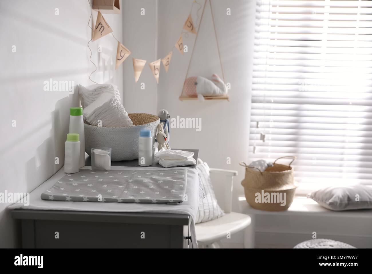 Chest of drawers with changing place in baby room. Interior design ...