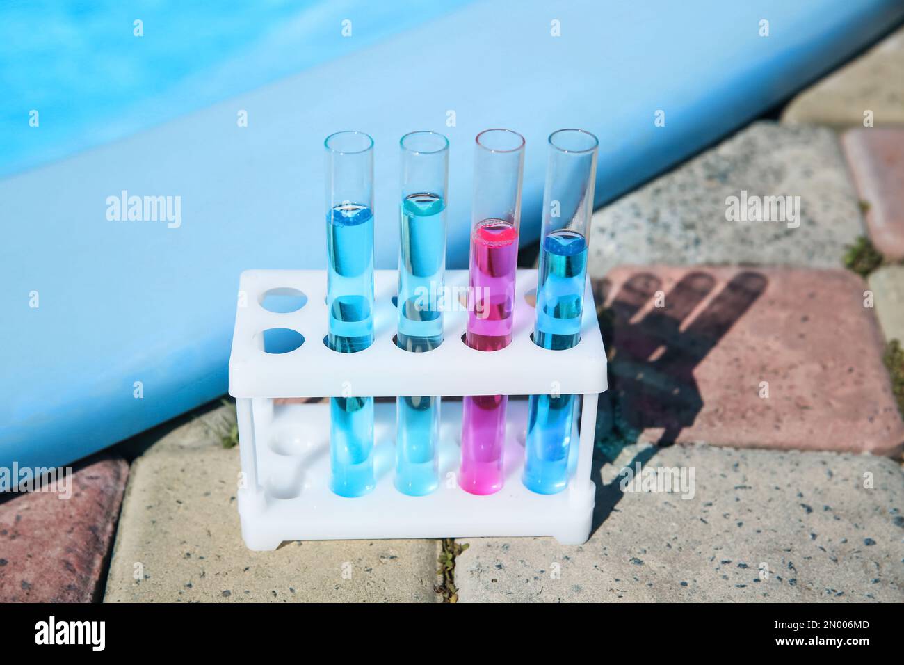 Test tubes with reagents in rack near swimming pool Stock Photo Alamy