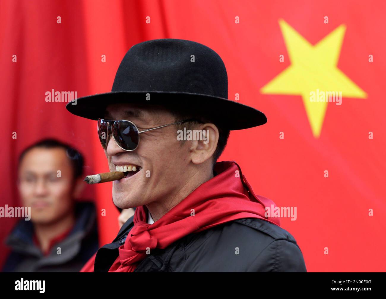 xi jinping cigarettes A China supporter smokes a cigar during a rally in support of Chinese  President Xi Jinping during his visit in Prague, Czech Republic, Tuesday,  March 29, 2016. (AP Photo/Petr David Josek Stock