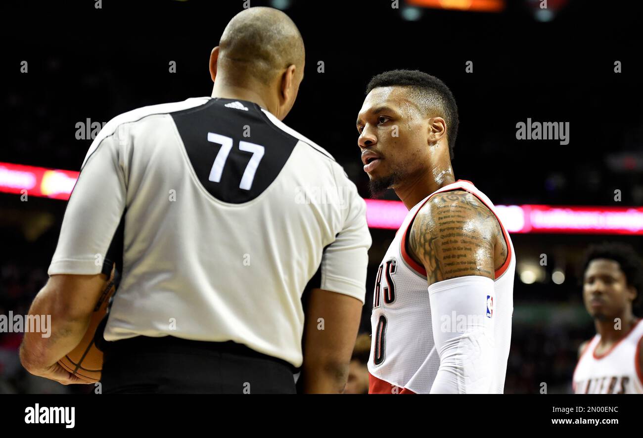 Portland Trail Blazers guard Damian Lillard (0) speaks with referee