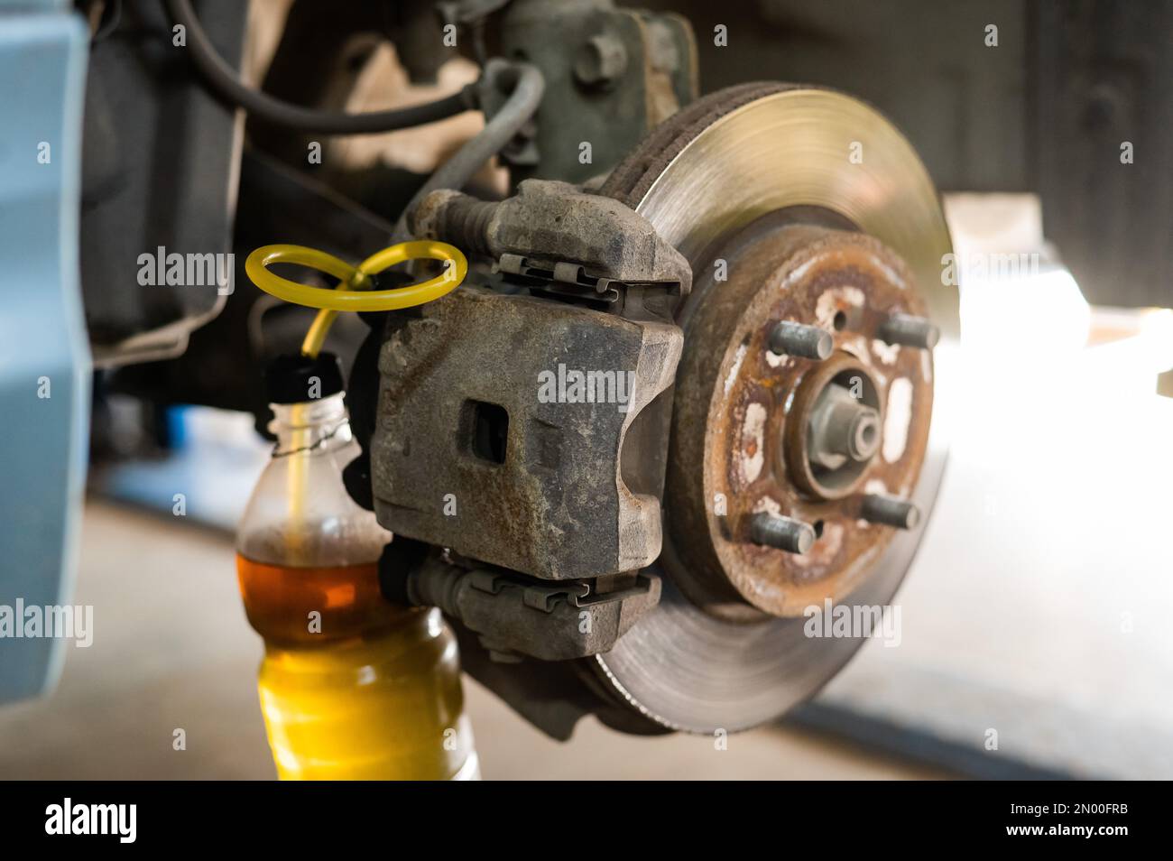Automatic change of brake fluid in a car service Stock Photo Alamy