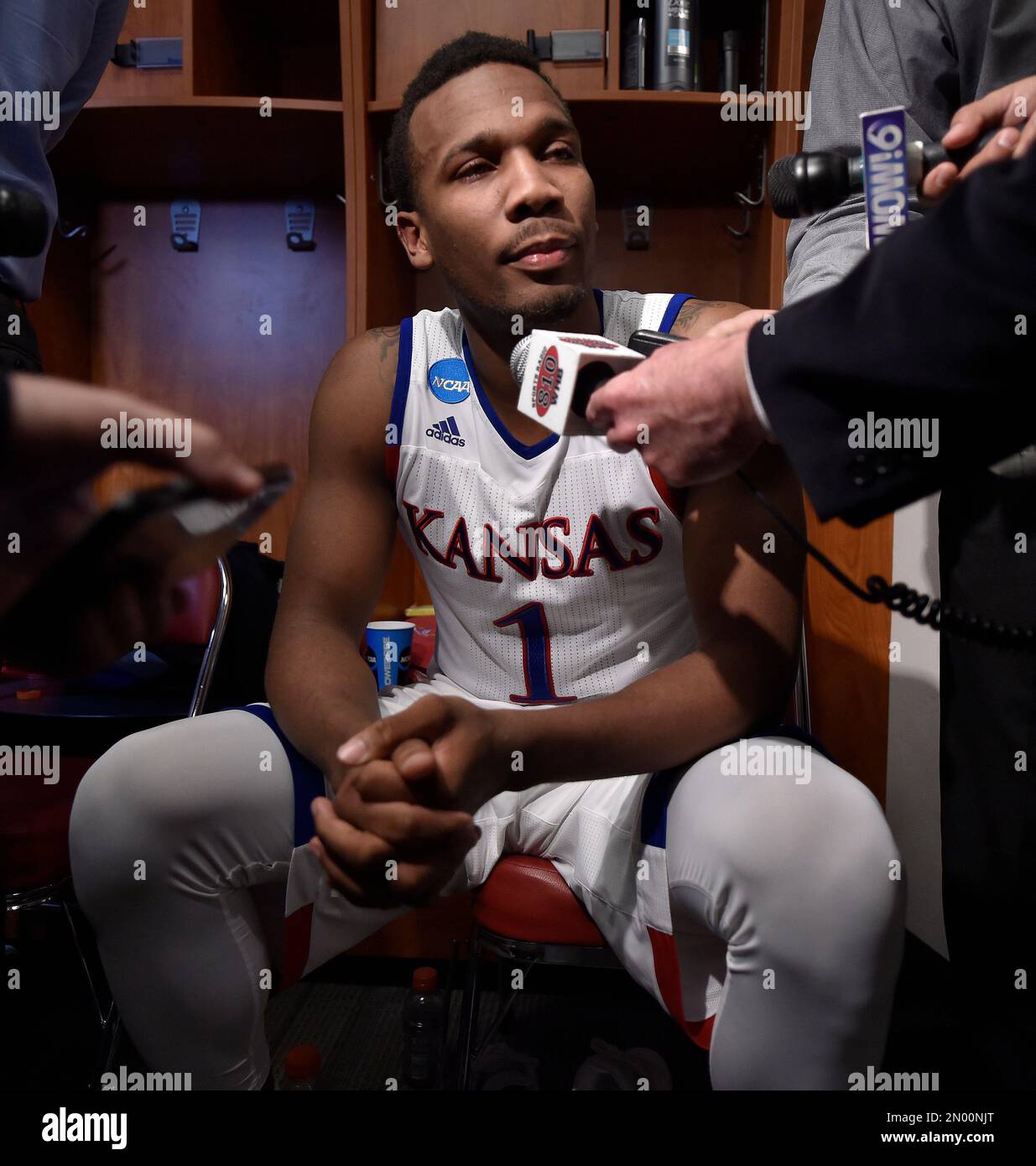 Kansas's Wayne Selden Jr., is interviewed in the locker room after a