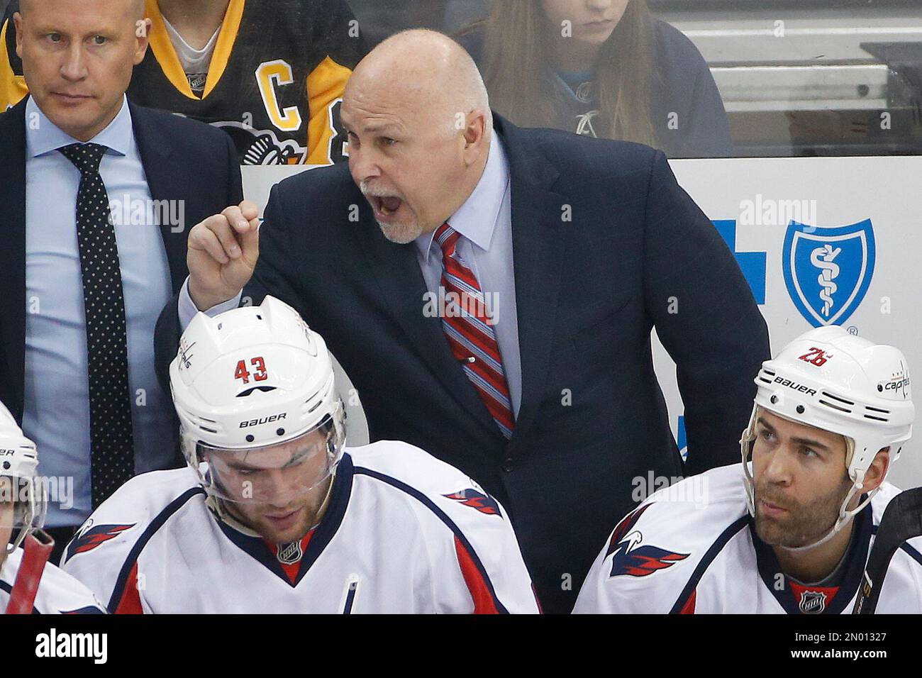 Washington Capitals head coach Barry Trotz stands gives instructions