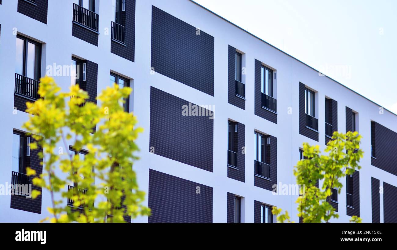 Modern residential building with new apartments in a green residential
