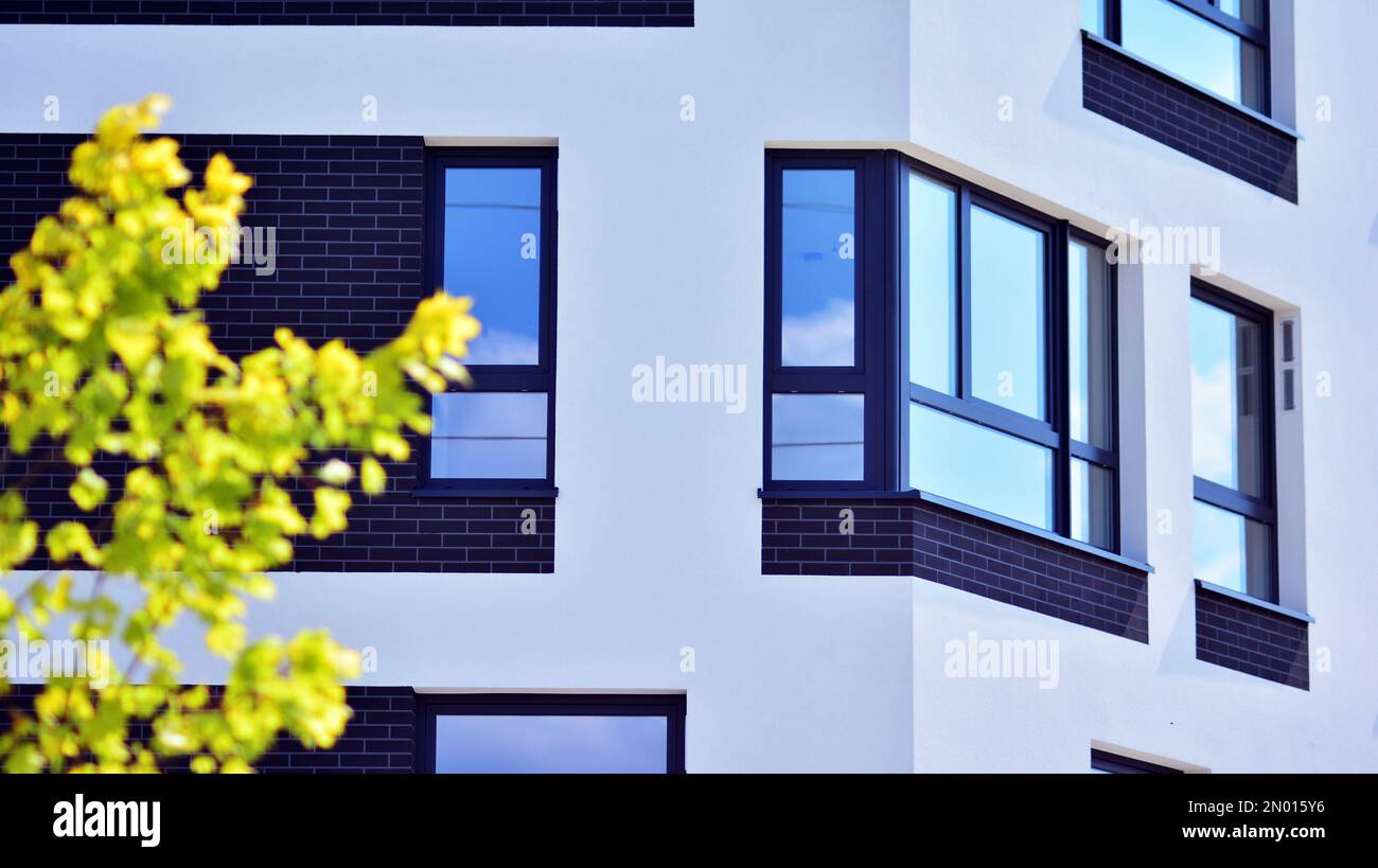 Modern residential building with new apartments in a green residential ...