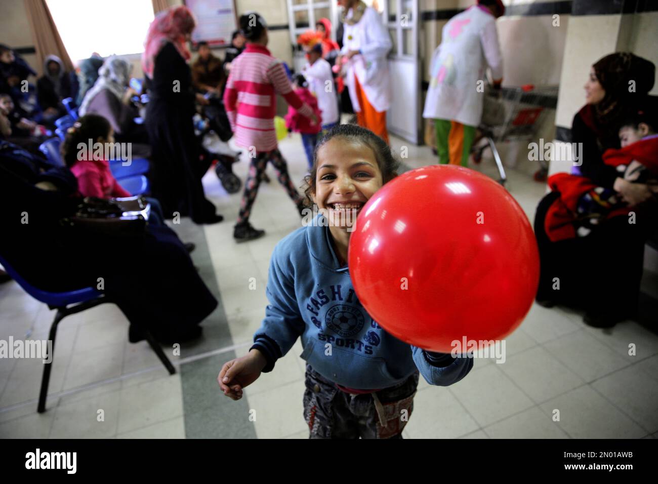 In this Thursday, March 17, 2016 photo, a child laughs during the visit ...