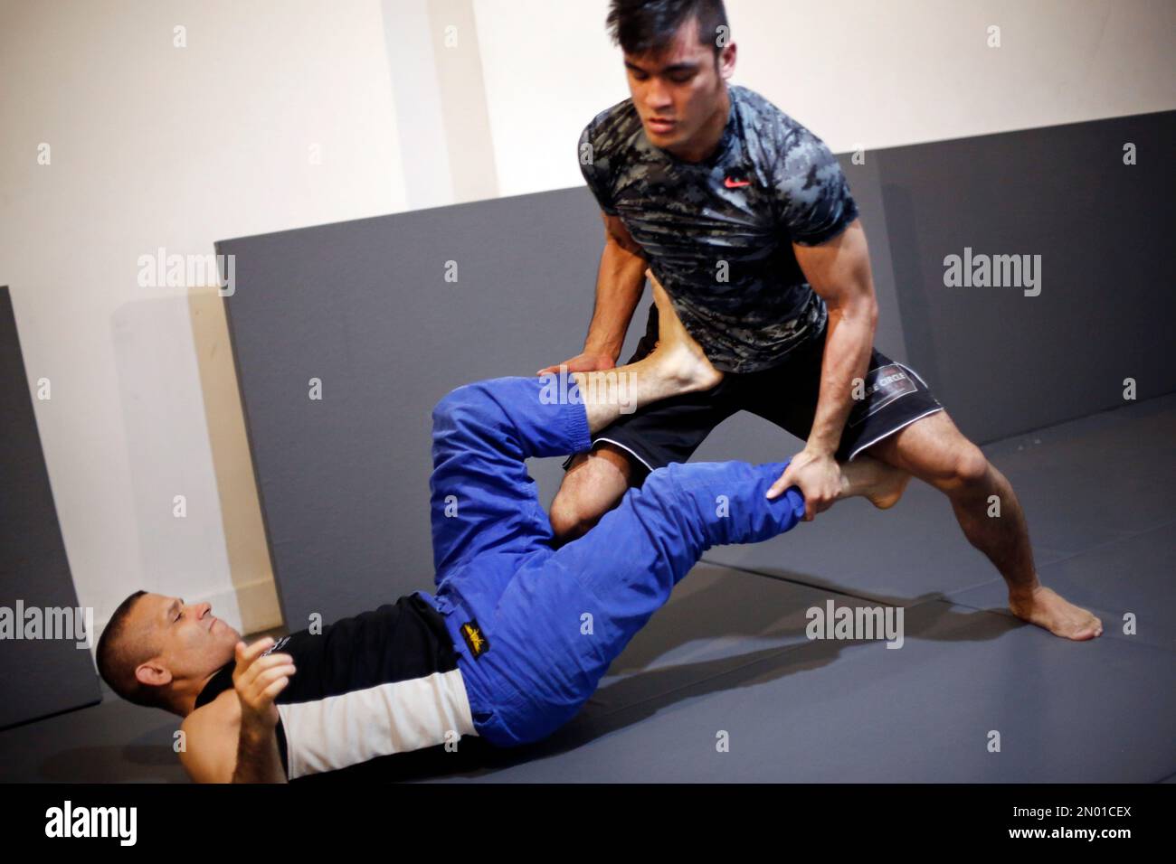 Rene Dreifuss, left, a mixed martial arts coach, trains Richard Callado at Radical  MMA NYC, a New York gym, Tuesday, March 22, 2016. New York is poised to end  its ban on