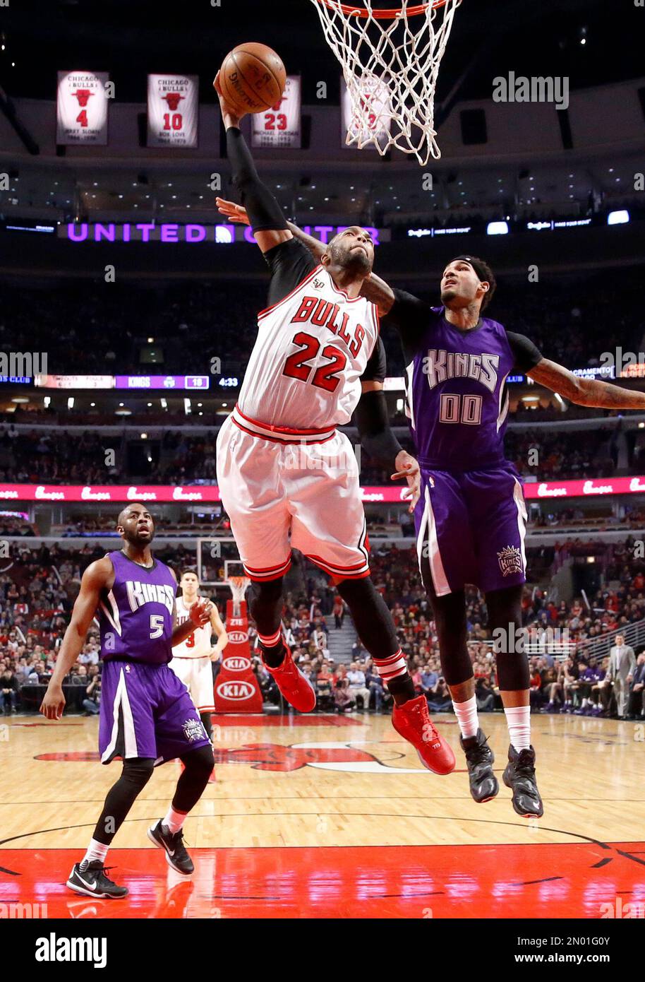 Chicago Bulls' Taj Gibson (22) dunks past Sacramento Kings' James